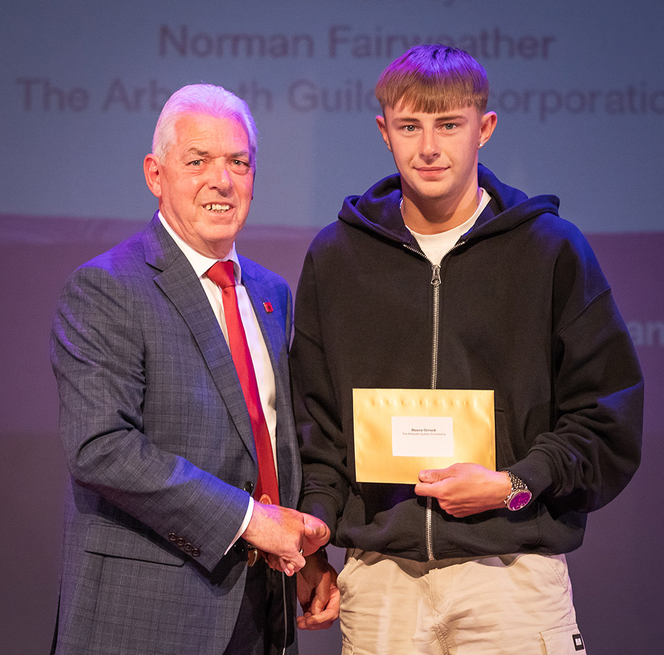 prize winner receiving their prize on stage