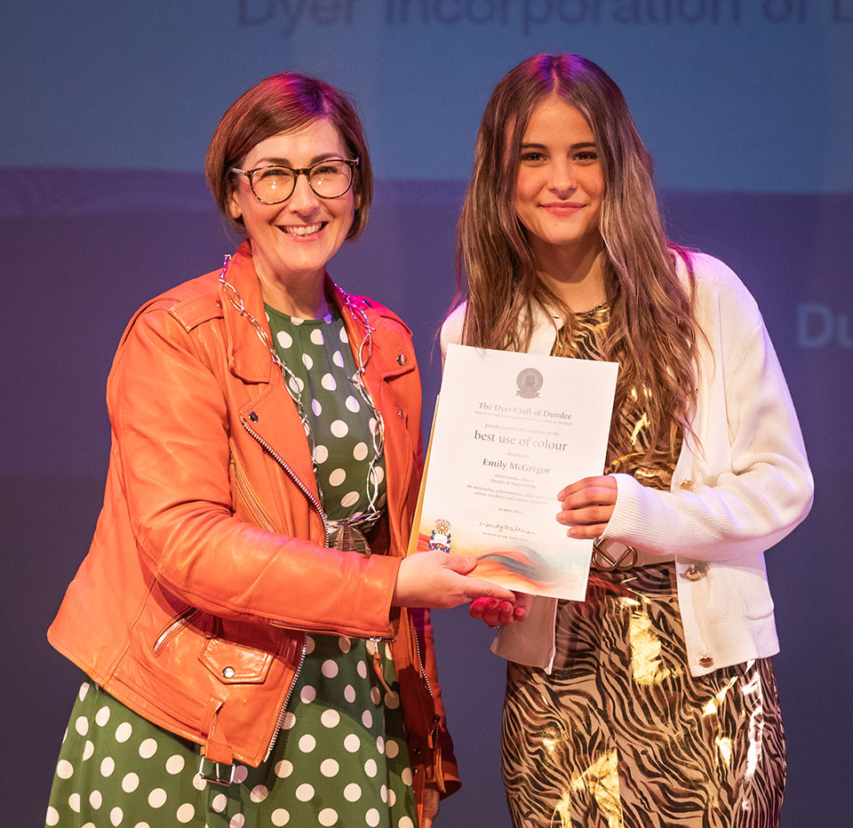 prize winner receiving their prize on stage