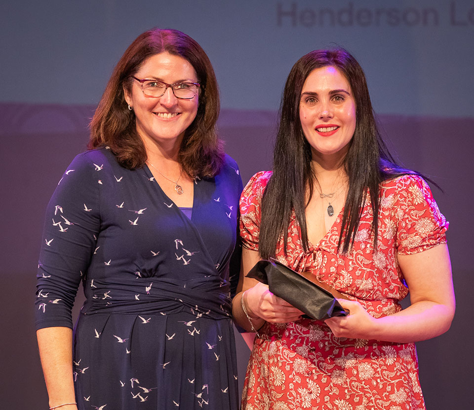 prize winner receiving their prize on stage