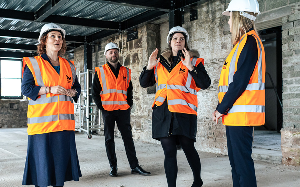 College staff visiting Montrose Port Skills Academy looking at interior of building