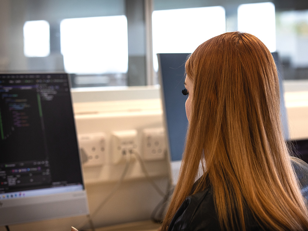 Student working on a college computer