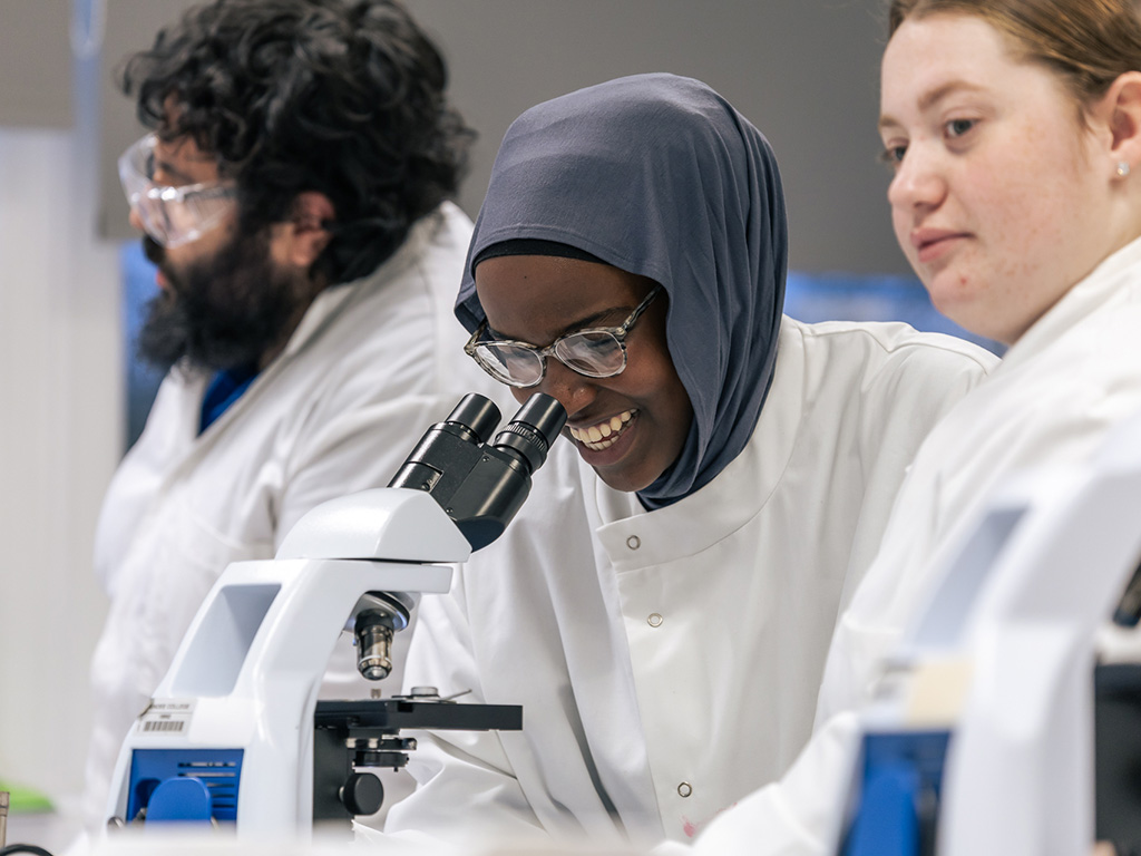 Student using a microscope